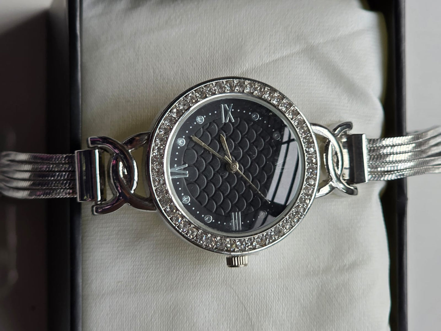 Sophisticated Silver Watch with Quilted Black Dial & Crystal Bezel - Roman Numerals