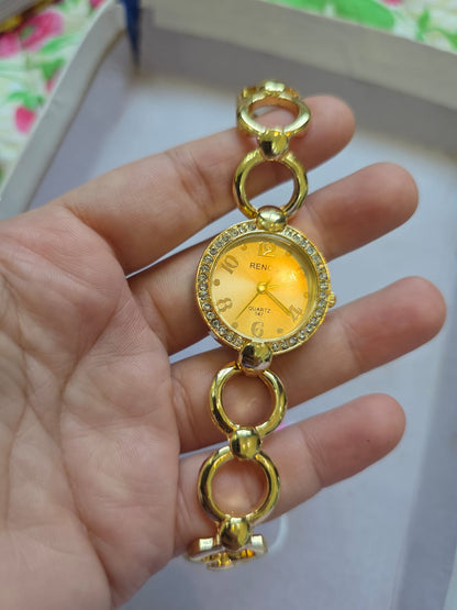 RENOS Elegant Crystal Bracelet Watch - Gold Tone Women's Quartz Timepiece