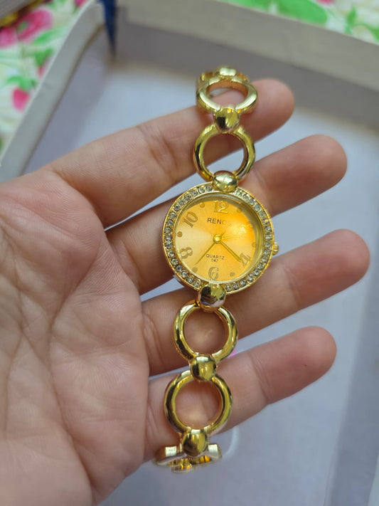 RENOS Elegant Crystal Bracelet Watch - Gold Tone Women's Quartz Timepiece