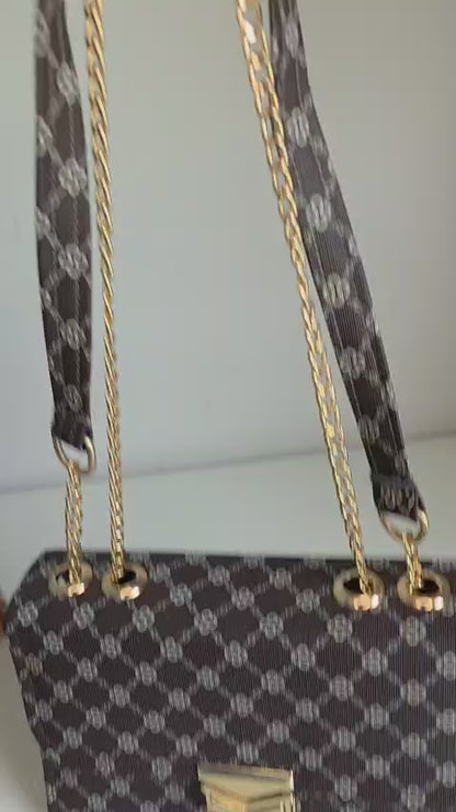 Elegant Black Handbag with Gold Chain Strap and Clasp