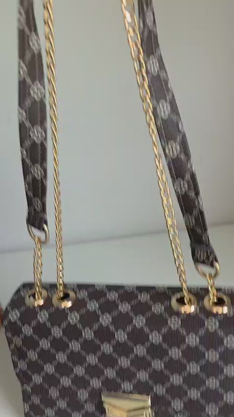Elegant Black Handbag with Gold Chain Strap and Clasp